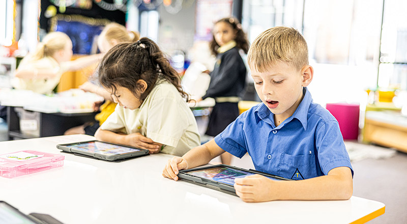 Boy and girl learning at St Josephs Catholic Primary Kingwood