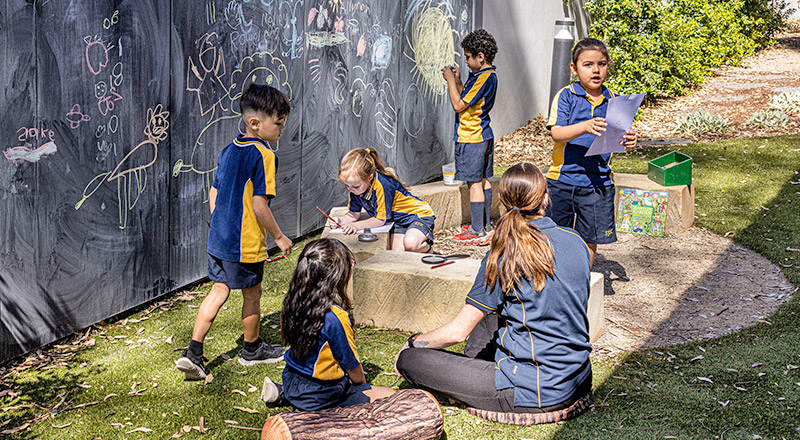 St Josephs Catholic Primary Kingwood students using outdoor blackboards