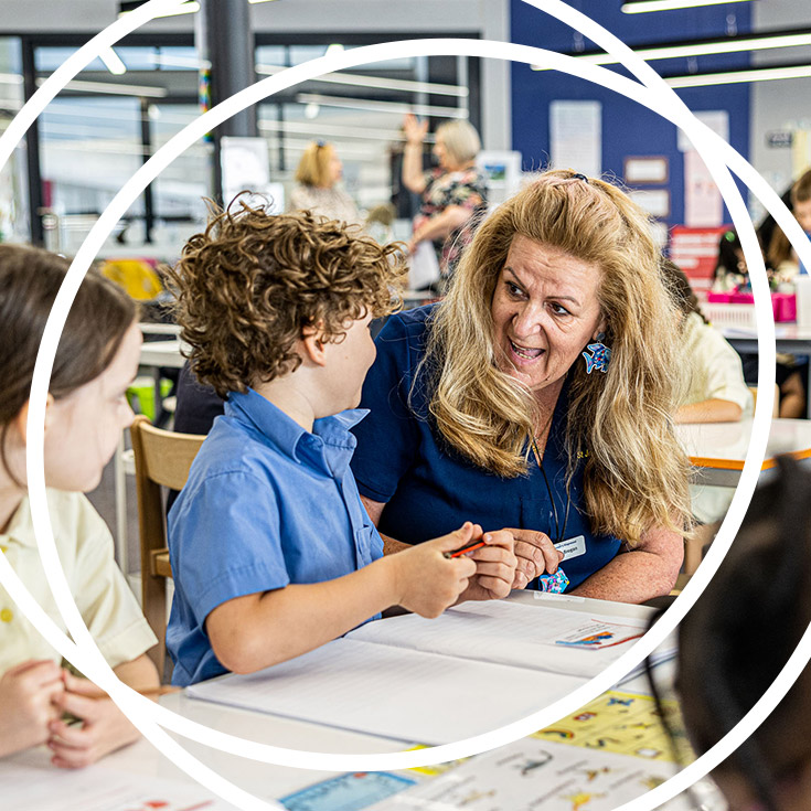 Teacher inspiring student at St Josephs Catholic Primary Kingwood