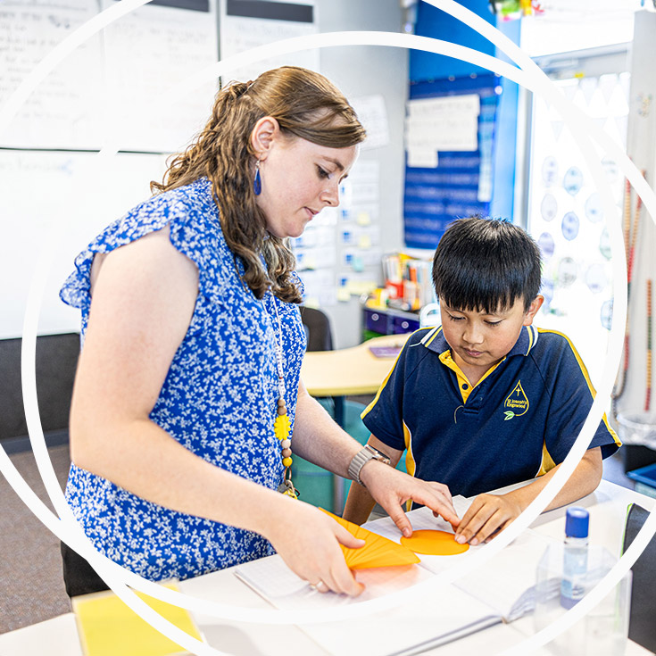 Teacher with student at St Josephs Catholic Primary Kingwood